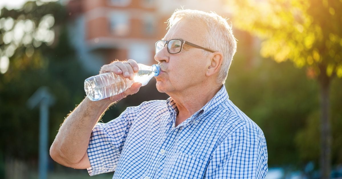 Staying hydrated can help keep a senior cool during the summer months.