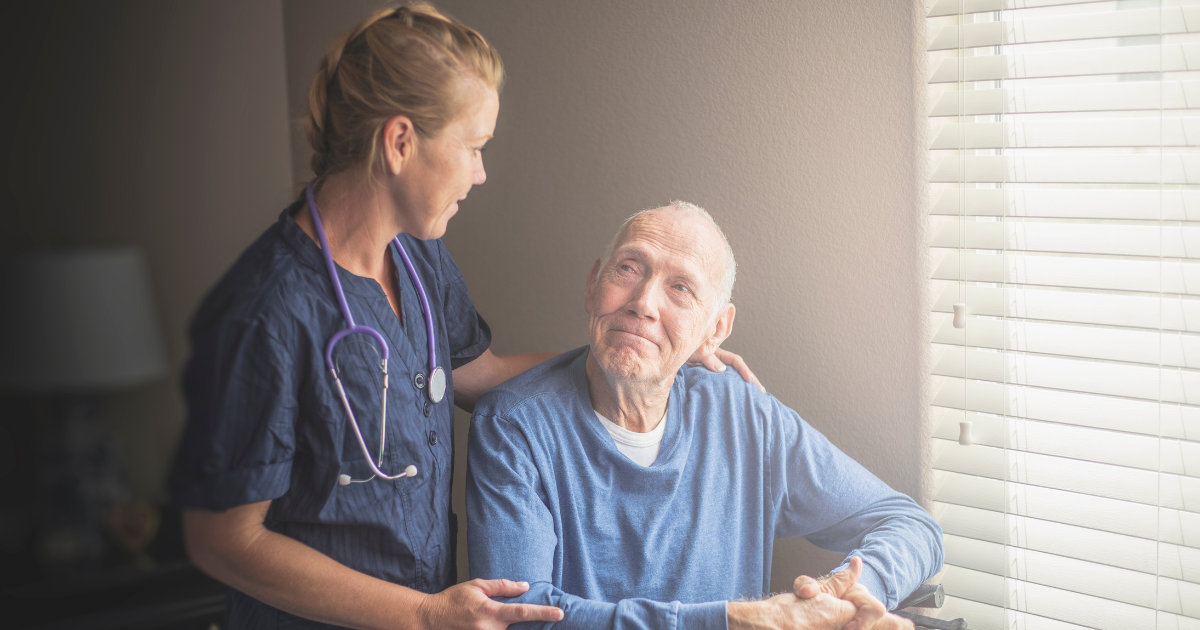 A senior is being helped by a care provider as a result of properly managing the cost of home care.
