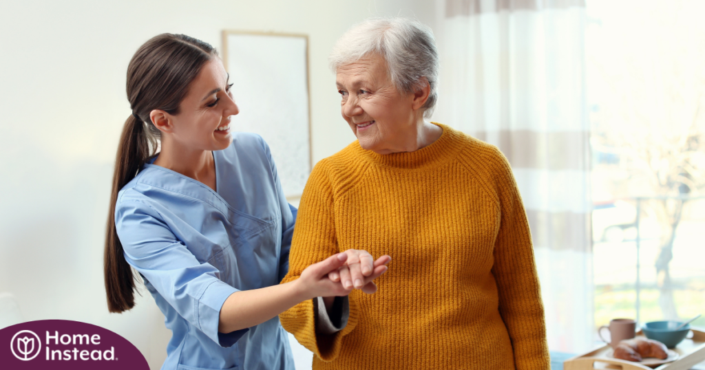 Professional caregivers, like this one who is helping a senior client walk, require a number of qualities and skills to provide compassionate personal care.