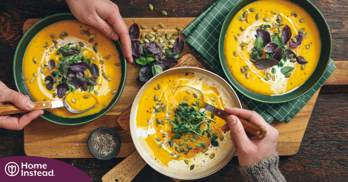 Pumpkin soup like the one in these bowls can be a great choice for a winter food for older adults.