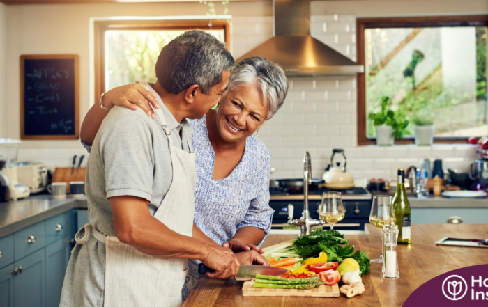 A senior couple enjoys cooking a healthy meal together, representing National Nutrition Month.